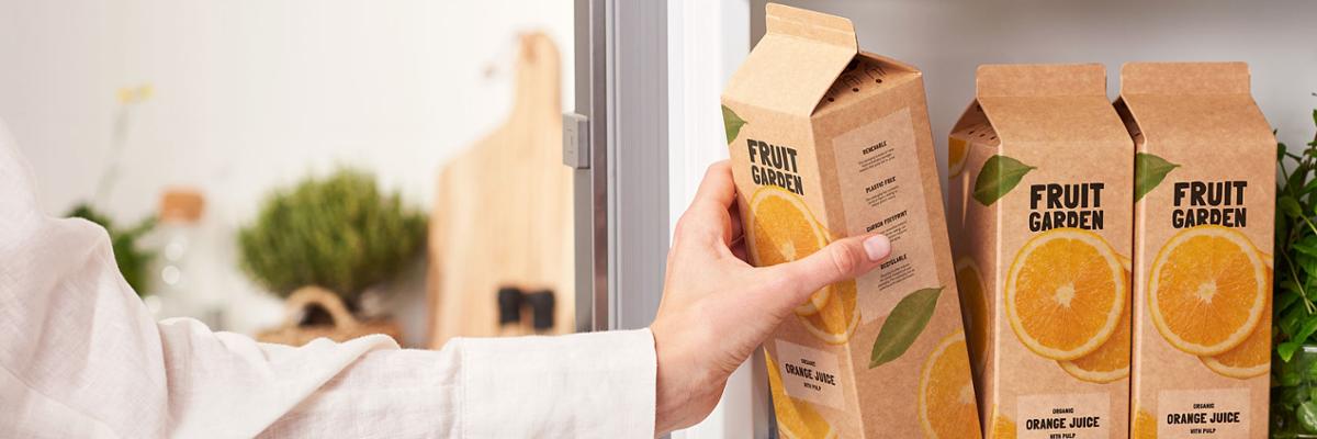Juice cartons in open fridge door.