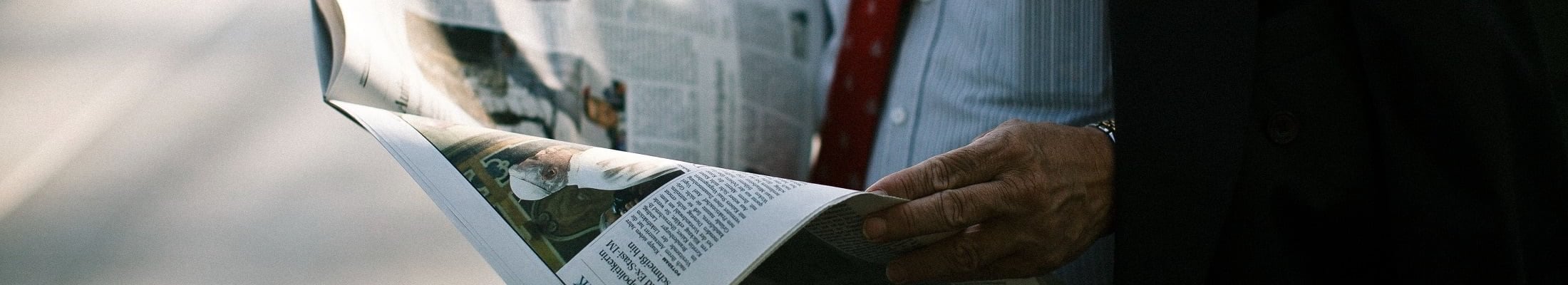 Man reading newspaper