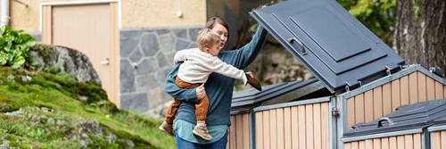 Woman and child recycling