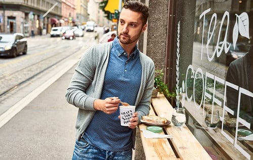 Man with disposable coffee cup