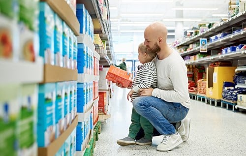 Father and son in shopping aisle