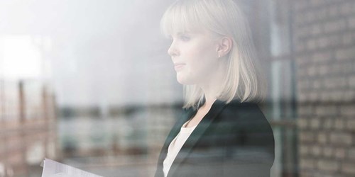 Woman looking out of window