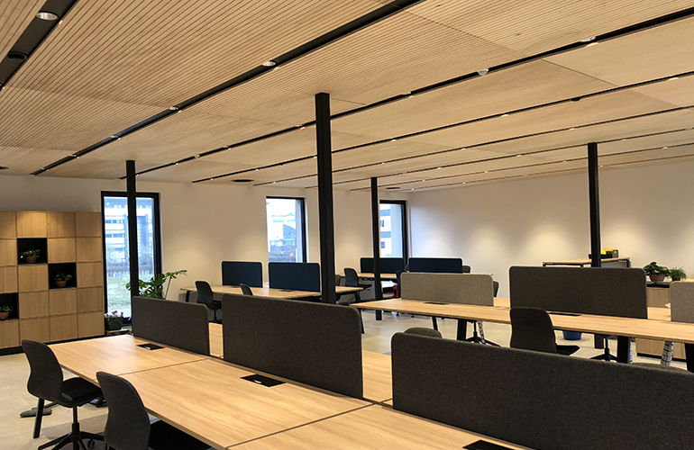 Inside the newly built office, wooden desks and chairs