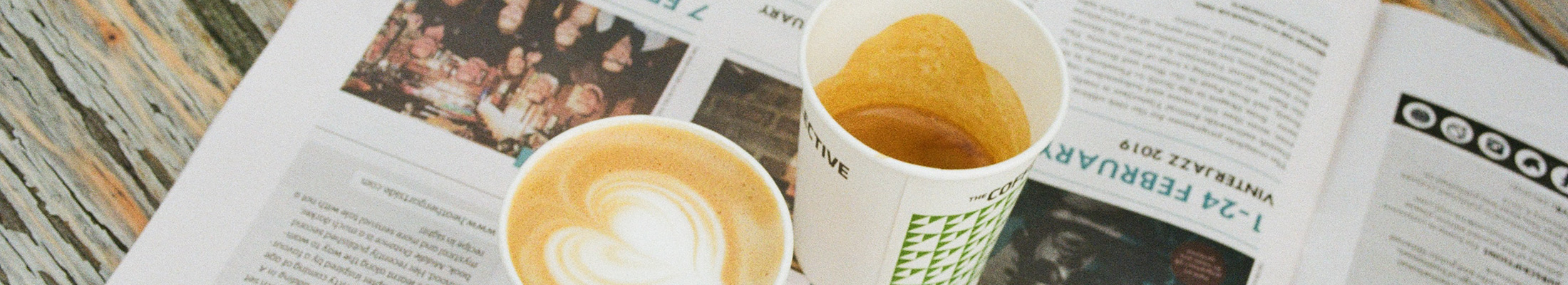 Magazine and cups of coffee