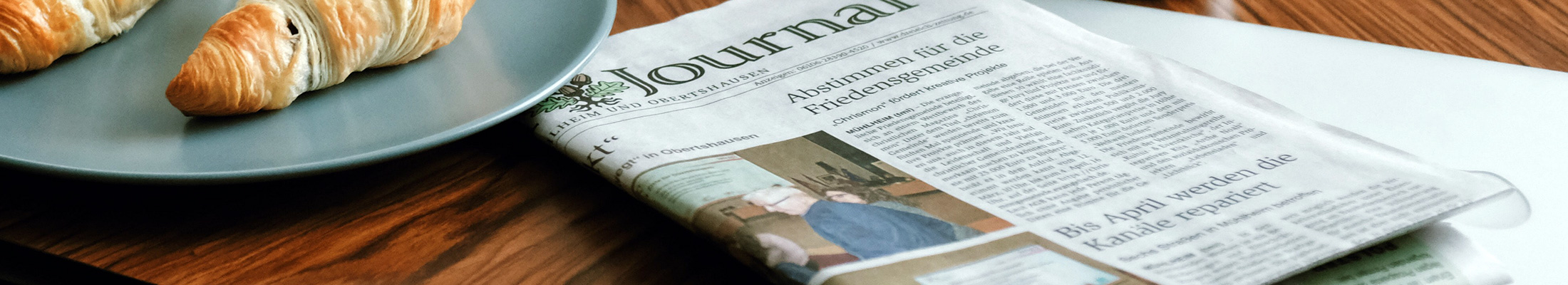 Newspaper and croissants