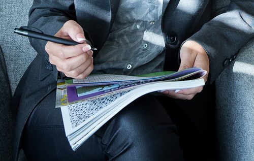 Woman writing crossword