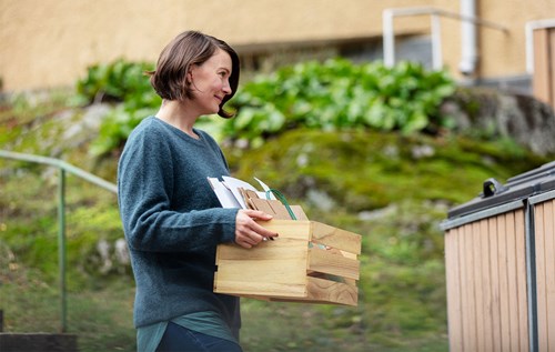 Recycling cardboard outside apartment building